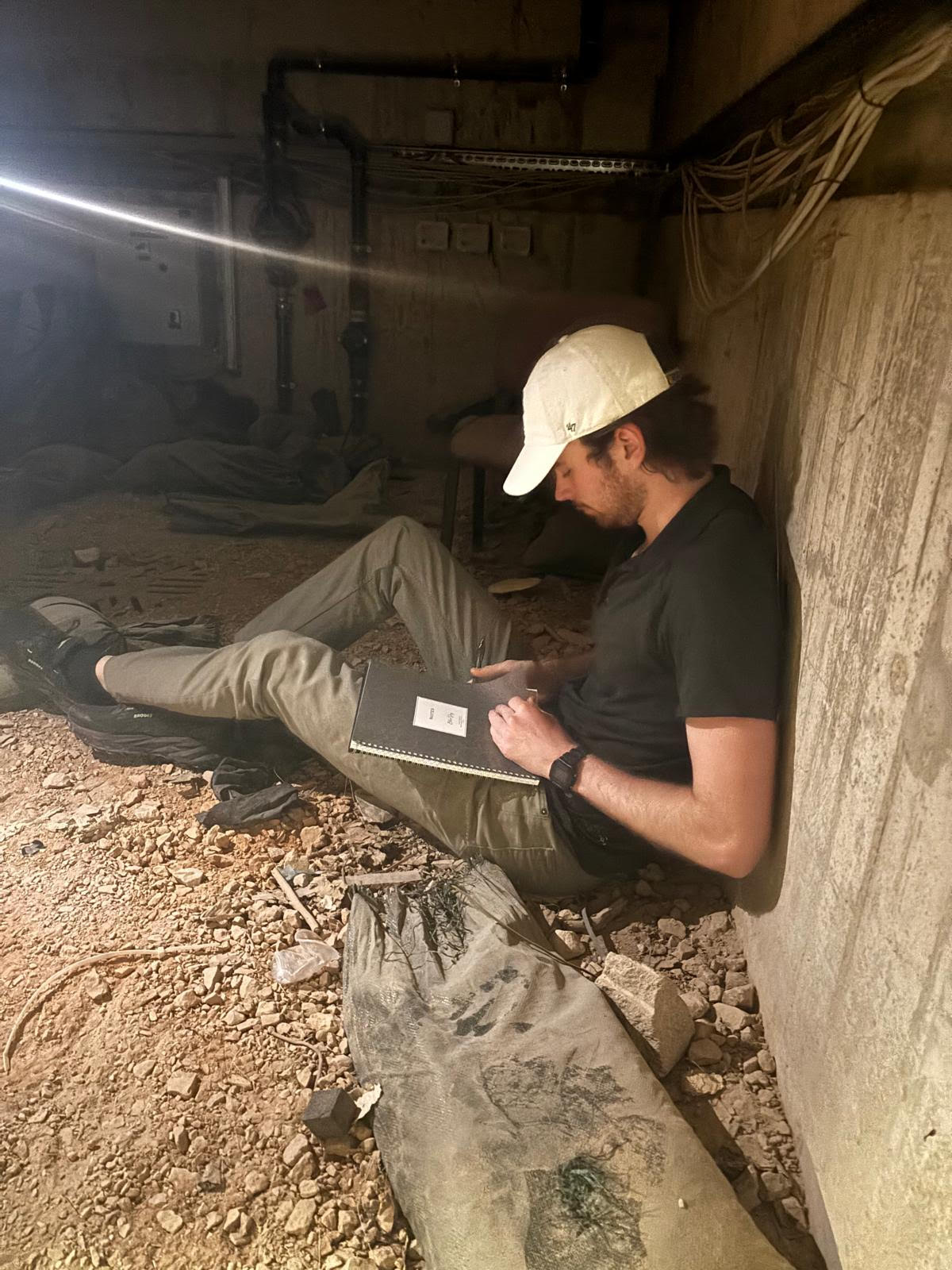 Cade Dalton conducting fieldwork notes during a tunnel deployment exercise